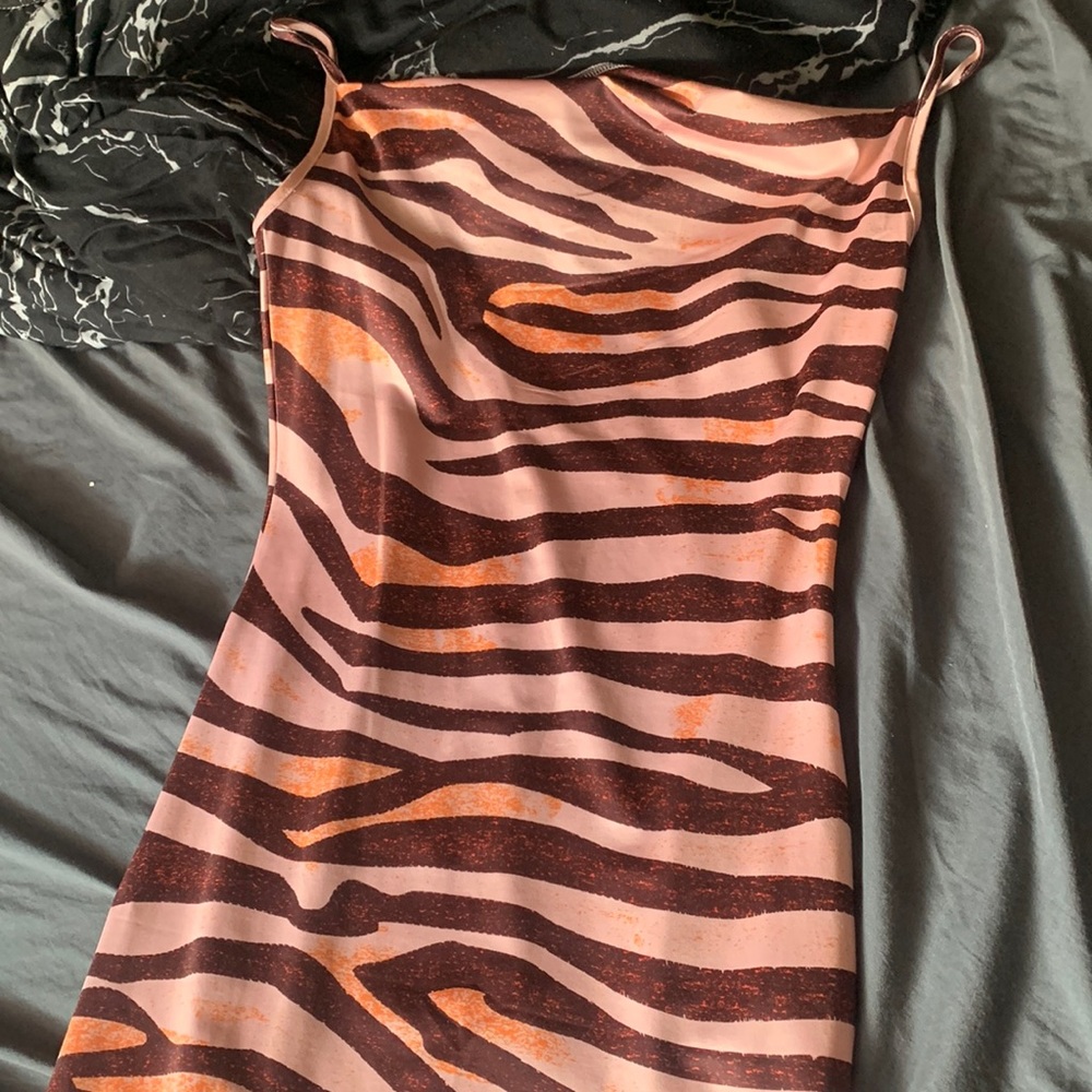 This is a midi/maxi dress. Colors of orange pink & brown. Amazon dress.
